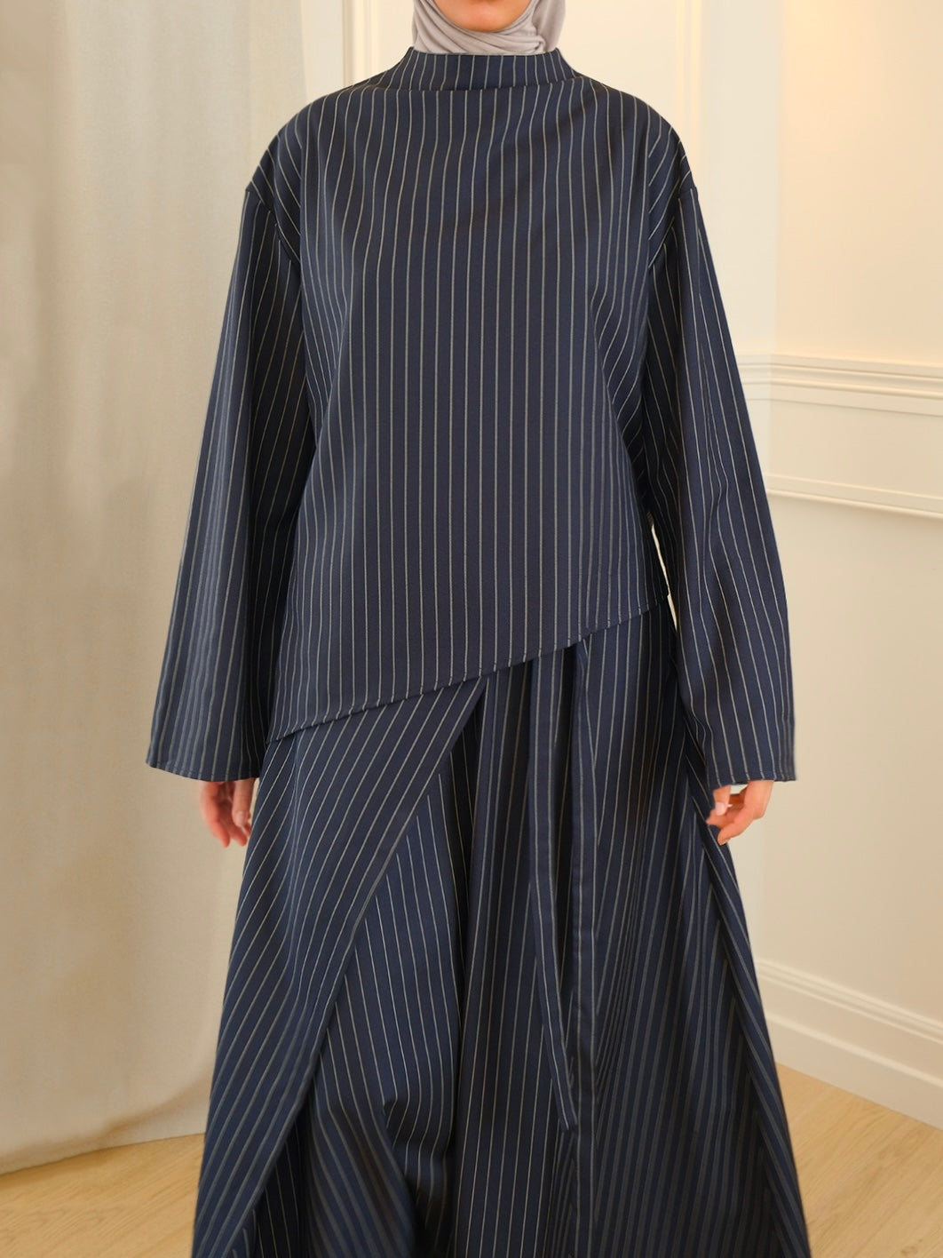 Top asymétrique rayé